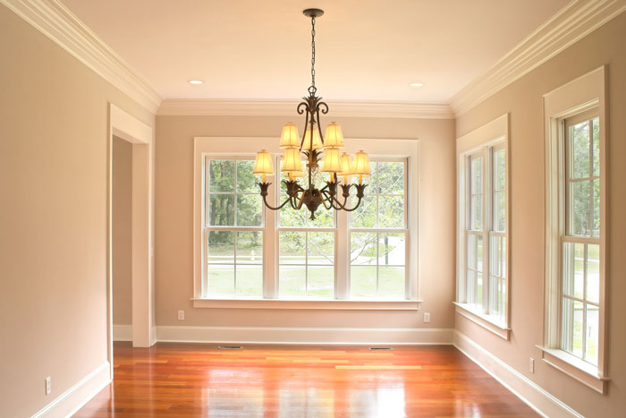 beautiful dining room with crown molding