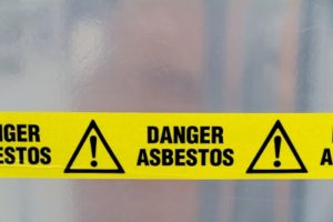 caution tape: danger asbestos